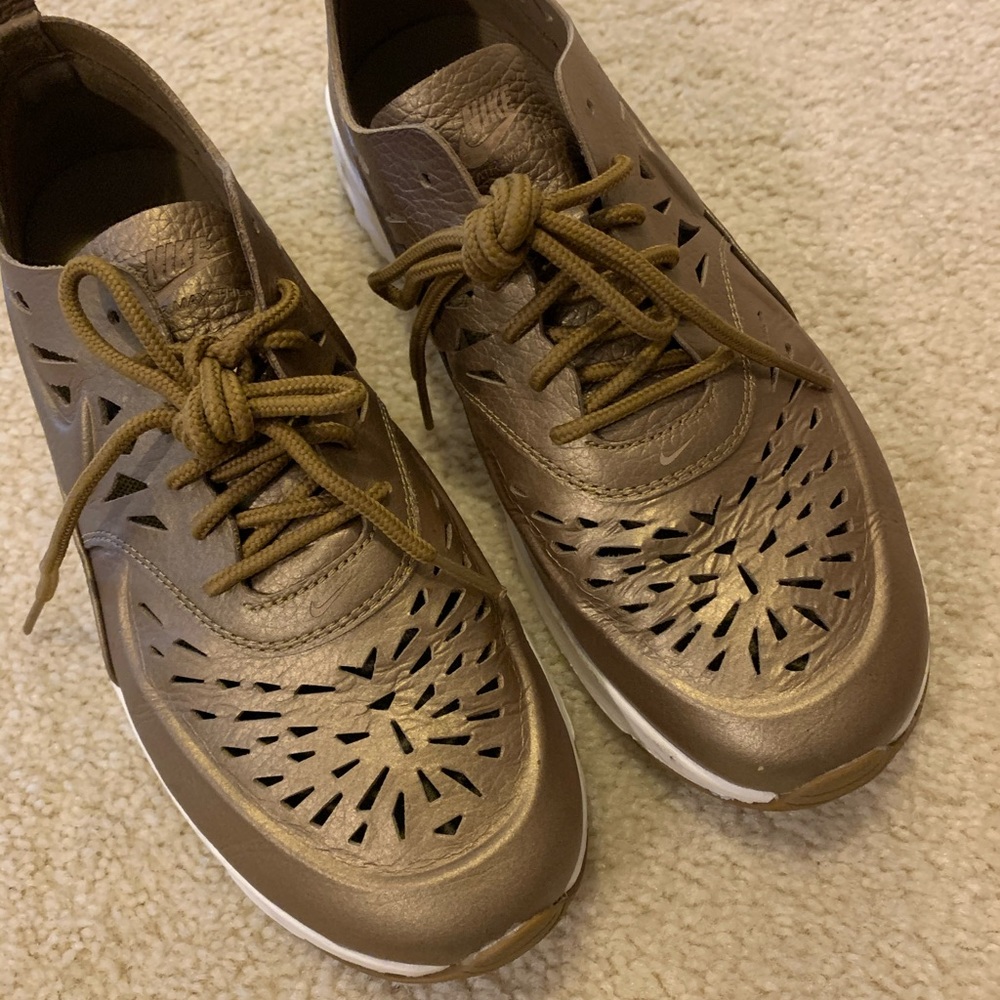Gold Nike Air Thea with laser cut detailing